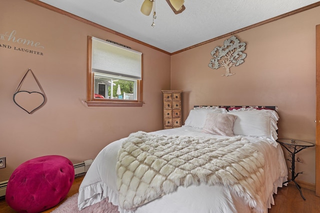 396 Huse Rd, Manchester, NH 03103 - bedroom with ornamental molding, wood finished floors, baseboards, ceiling fan, and a baseboard radiator