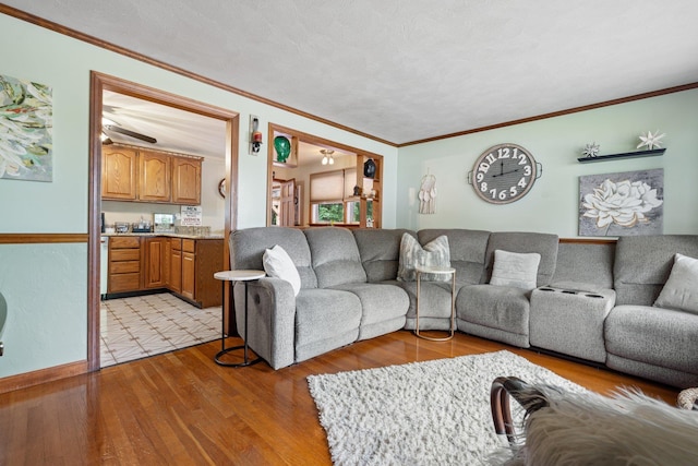 396 Huse Rd, Manchester, NH 03103 - living room with ornamental molding, light wood-style flooring, and baseboards