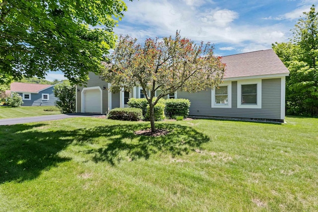 10 Vappi Vale Ln, Moultonborough, NH 03254 - obstructed view of property featuring asphalt driveway, an attached garage, a front lawn, and a shingled roof