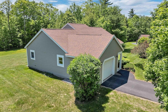 10 Vappi Vale Ln, Moultonborough, NH 03254 - view of property exterior featuring a lawn, a shingled roof, and driveway