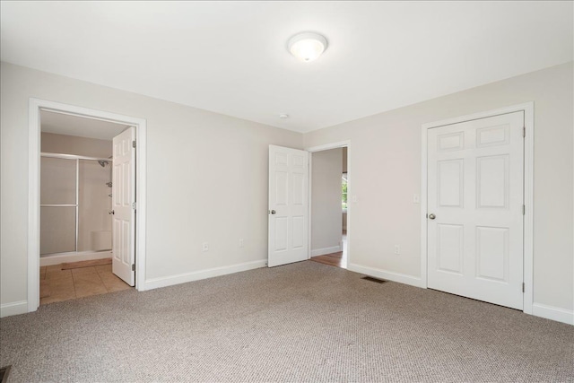 61 Leddy Dr, Epping, NH 03042 - unfurnished bedroom with carpet, baseboards, and ensuite bath