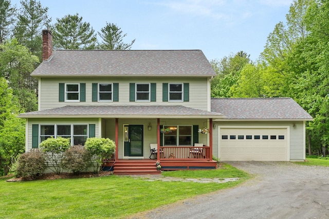 138 Connor Rd, Montpelier, VT 05602 - view of front facade with a chimney, a garage, driveway, a porch, and a front yard