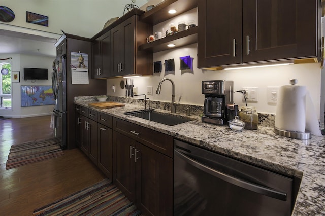 16 Carleton Way, Hales Location, NH 03860 - kitchen with stainless steel appliances, a sink, dark wood finished floors, dark brown cabinets, and light stone counters