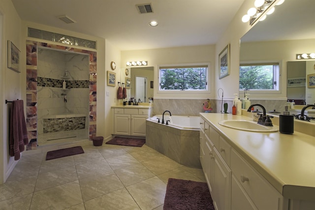 16 Carleton Way, Hales Location, NH 03860 - bathroom featuring a garden tub, tiled shower, two vanities, and recessed lighting
