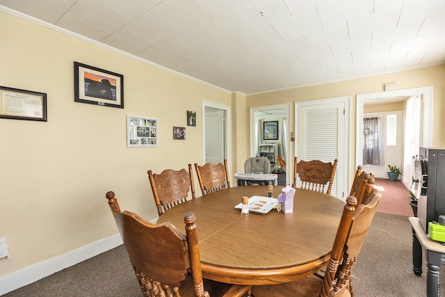 90 Sullivan St, Claremont, NH 03743 - dining area with ornamental molding, carpet floors, and baseboards