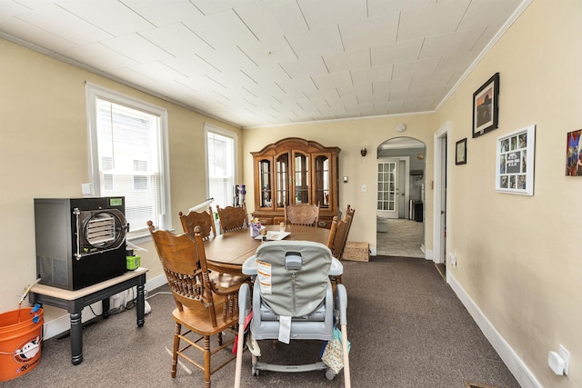 90 Sullivan St, Claremont, NH 03743 - dining space featuring arched walkways, ornamental molding, and baseboards