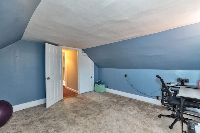90 Sullivan St, Claremont, NH 03743 - home office with lofted ceiling, carpet floors, and baseboards