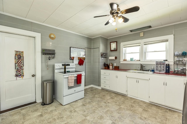 90 Sullivan St, Claremont, NH 03743 - kitchen with a sink, electric stove, white cabinets, ceiling fan, and ornamental molding