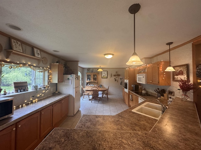 182 Franks Way, Middlesex, VT 05602 - kitchen featuring white appliances, a sink, light tile patterned flooring, dark countertops, and a textured ceiling