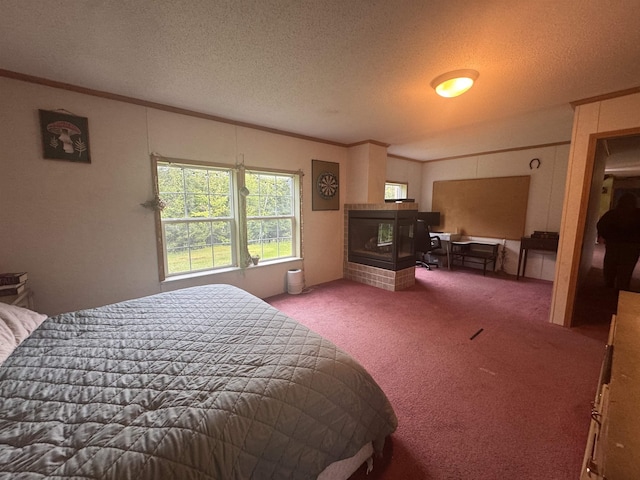 182 Franks Way, Middlesex, VT 05602 - bedroom with carpet flooring, ornamental molding, a textured ceiling, and a tile fireplace