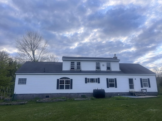 182 Franks Way, Middlesex, VT 05602 - rear view of house with oil tank, a lawn, a chimney, and entry steps