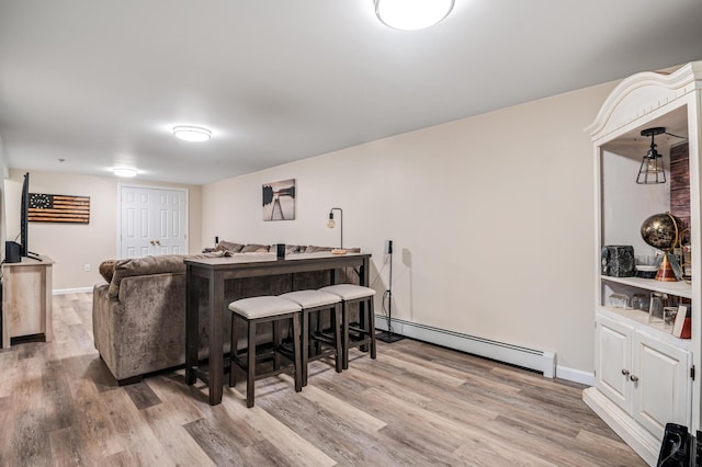 19 Abbott Rd, Concord, NH 03303 - living area featuring baseboard heating, wood finished floors, and baseboards
