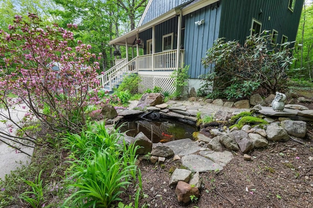 5 Adams Rd, Jackson, NH 03846 - view of side of home featuring a garden pond