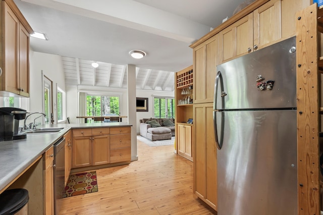 5 Adams Rd, Jackson, NH 03846 - kitchen with appliances with stainless steel finishes, a sink, a peninsula, light wood-style floors, and beamed ceiling