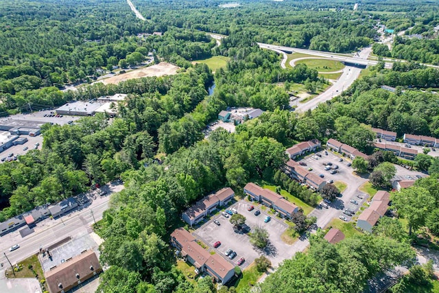 3 Cedarbrook Ave Unit C, Rochester, NH 03867 - aerial view of property and surrounding area featuring a heavily wooded area