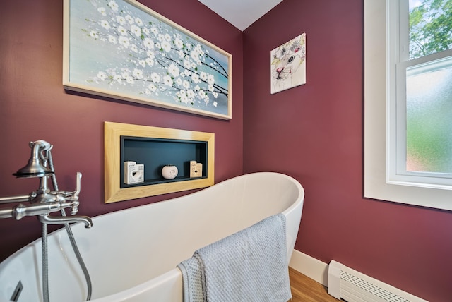 22 Westray Dr, Nashua, NH 03062 - bathroom view of a baseboard heating unit and a freestanding tub