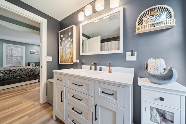 22 Westray Dr, Nashua, NH 03062 - full bathroom with connected bathroom, vanity, and wood finished floors