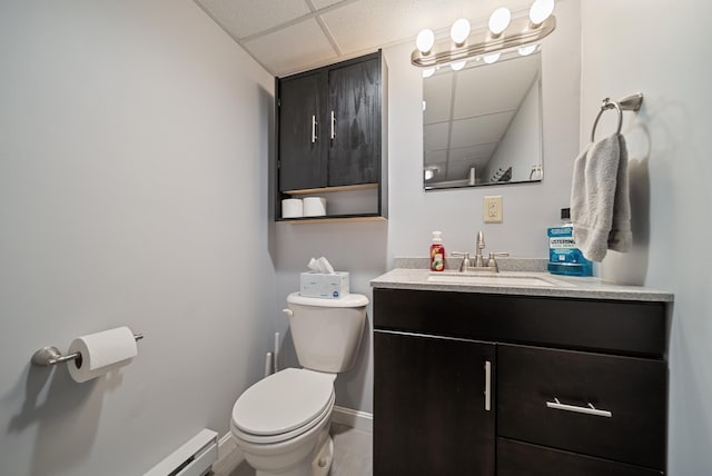 22 Westray Dr, Nashua, NH 03062 - half bath with a paneled ceiling, toilet, vanity, and baseboards