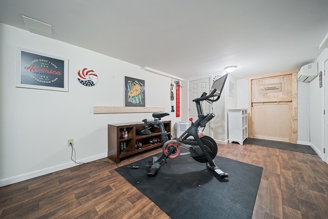 22 Westray Dr, Nashua, NH 03062 - exercise room with a wall mounted air conditioner, baseboards, and wood finished floors