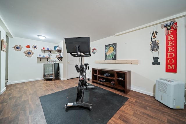 22 Westray Dr, Nashua, NH 03062 - exercise area with wood finished floors, baseboards, and a bar