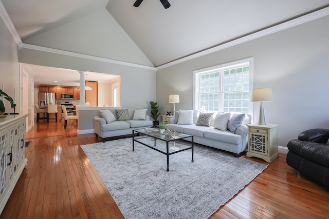 7 Adella Dr, Nashua, NH 03063 - living area featuring ornate columns, a ceiling fan, hardwood / wood-style floors, high vaulted ceiling, and ornamental molding