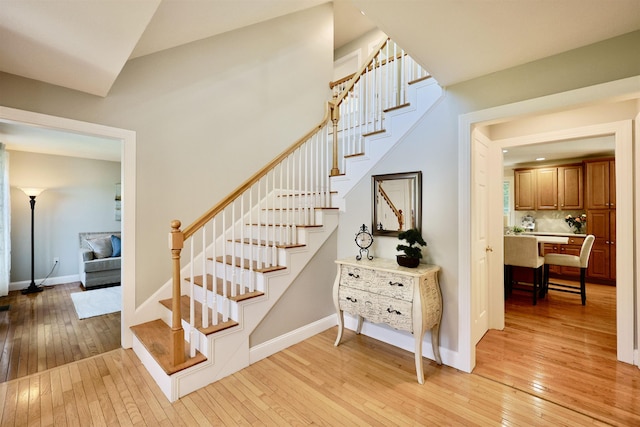 7 Adella Dr, Nashua, NH 03063 - stairway with hardwood / wood-style floors, baseboards, and vaulted ceiling
