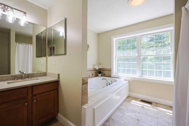 7 Adella Dr, Nashua, NH 03063 - bathroom featuring vanity, baseboards, and a tub with jets