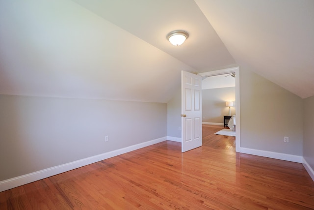 7 Adella Dr, Nashua, NH 03063 - bonus room with light wood-style floors, lofted ceiling, and baseboards