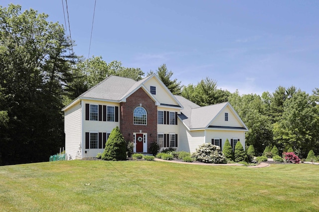 7 Adella Dr, Nashua, NH 03063 - colonial-style house featuring a front yard