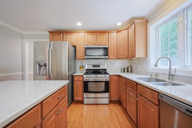 7 Adella Dr, Nashua, NH 03063 - kitchen featuring stainless steel appliances, a sink, ornamental molding, light wood-style floors, and recessed lighting