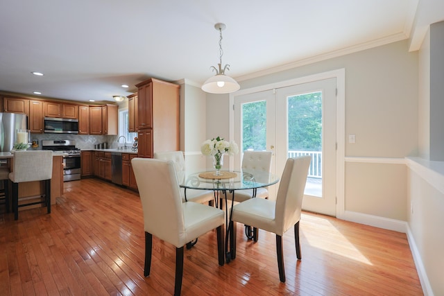 7 Adella Dr, Nashua, NH 03063 - dining space featuring light wood-style floors, baseboards, crown molding, and recessed lighting