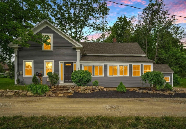 9 Grove Rd, Lyndeborough, NH 03082 - view of front of house with roof with shingles, dirt driveway, and a chimney