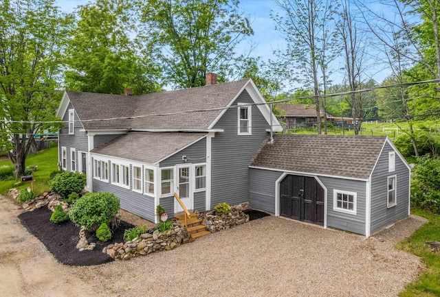 9 Grove Rd, Lyndeborough, NH 03082 - view of front facade featuring a chimney, roof with shingles, driveway, and entry steps