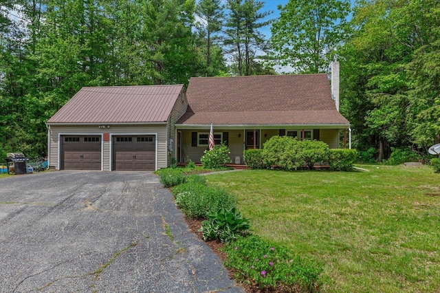 780 Greenfield Rd, Peterborough, NH 03458 - view of front facade featuring a chimney, an attached garage, driveway, a front yard, and covered porch