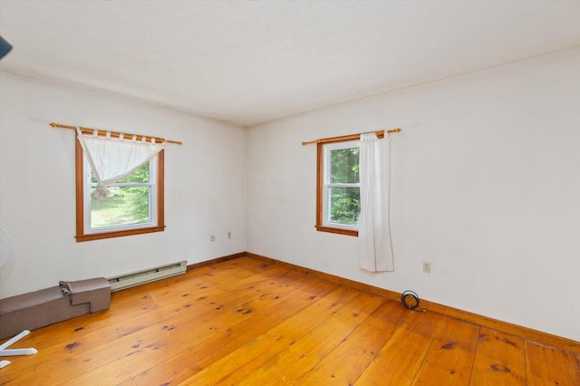 780 Greenfield Rd, Peterborough, NH 03458 - empty room with a baseboard radiator, light wood-type flooring, and baseboards