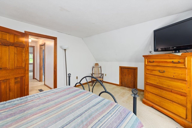 780 Greenfield Rd, Peterborough, NH 03458 - bedroom with light carpet, vaulted ceiling, and baseboards