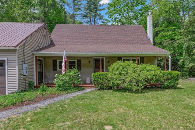 780 Greenfield Rd, Peterborough, NH 03458 - view of front of home with a chimney, a porch, and a front lawn