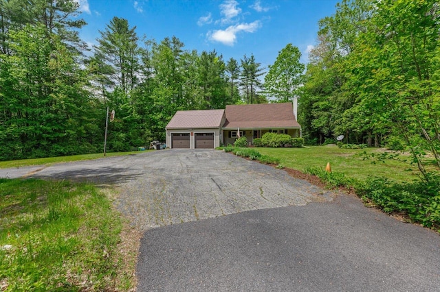 780 Greenfield Rd, Peterborough, NH 03458 - view of front facade featuring a garage, asphalt driveway, and a front yard