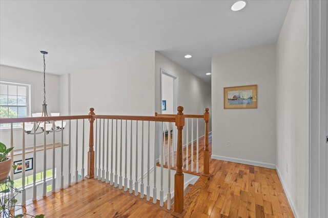168 Raven Cir, Williston, VT 05495 - hall featuring an upstairs landing, wood finished floors, recessed lighting, and baseboards