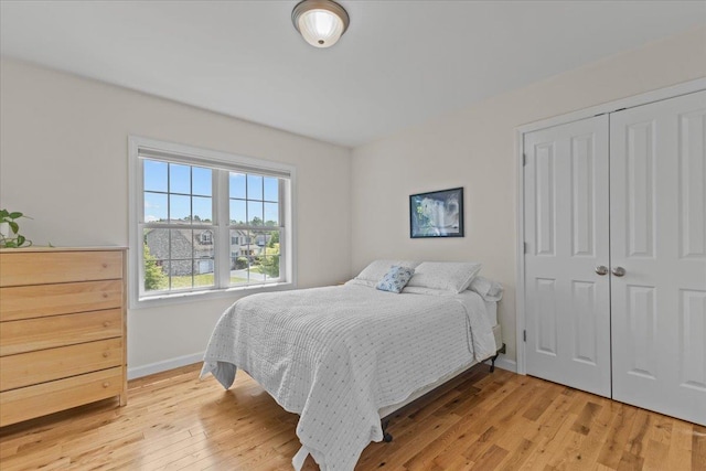 168 Raven Cir, Williston, VT 05495 - bedroom featuring baseboards, light wood finished floors, and a closet