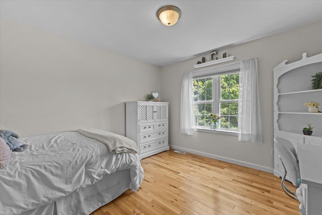 168 Raven Cir, Williston, VT 05495 - bedroom featuring baseboards and light wood-style flooring