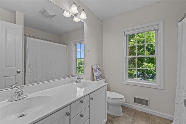 168 Raven Cir, Williston, VT 05495 - bathroom featuring double vanity, baseboards, toilet, tile patterned floors, and a shower with shower curtain