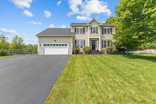 168 Raven Cir, Williston, VT 05495 - colonial home with a garage and asphalt driveway
