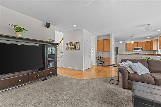 168 Raven Cir, Williston, VT 05495 - living room featuring light carpet, stairs, recessed lighting, and baseboards
