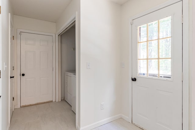 179 Arbor Ln, Colchester, VT 05446 - doorway featuring plenty of natural light, washer / dryer, and baseboards
