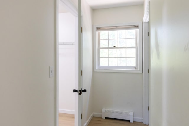 179 Arbor Ln, Colchester, VT 05446 - hall featuring baseboard heating, plenty of natural light, baseboards, and light wood-style floors