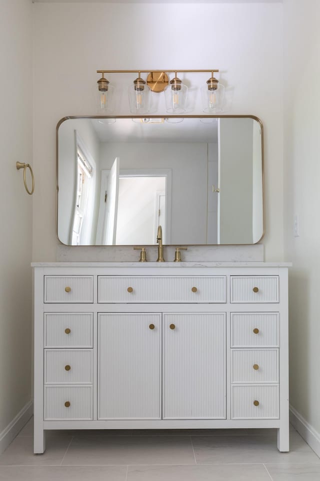 179 Arbor Ln, Colchester, VT 05446 - bathroom with baseboards, tile patterned flooring, and vanity