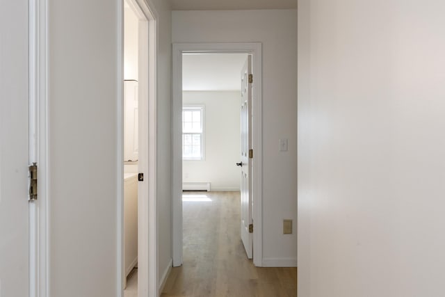 179 Arbor Ln, Colchester, VT 05446 - hallway with a baseboard radiator, light wood-type flooring, and baseboards