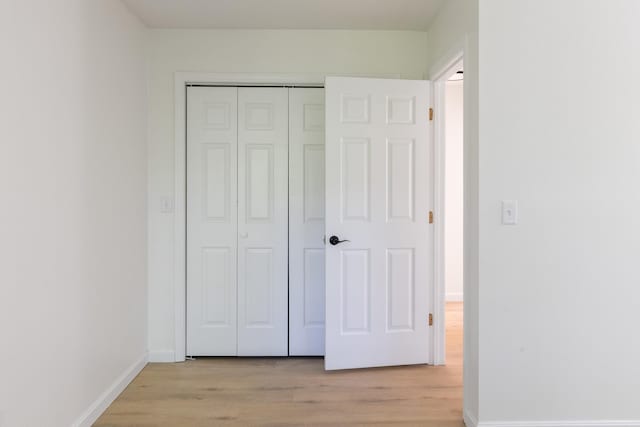 179 Arbor Ln, Colchester, VT 05446 - unfurnished bedroom with light wood-type flooring, a closet, and baseboards
