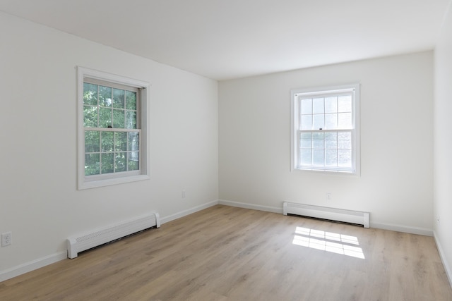 179 Arbor Ln, Colchester, VT 05446 - unfurnished room with a baseboard radiator, light wood-type flooring, and baseboards